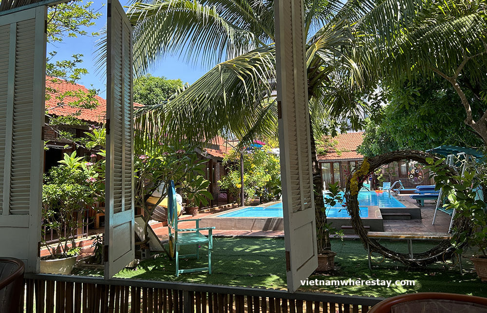 Swimming pool view at May Bungalow from restaurant
