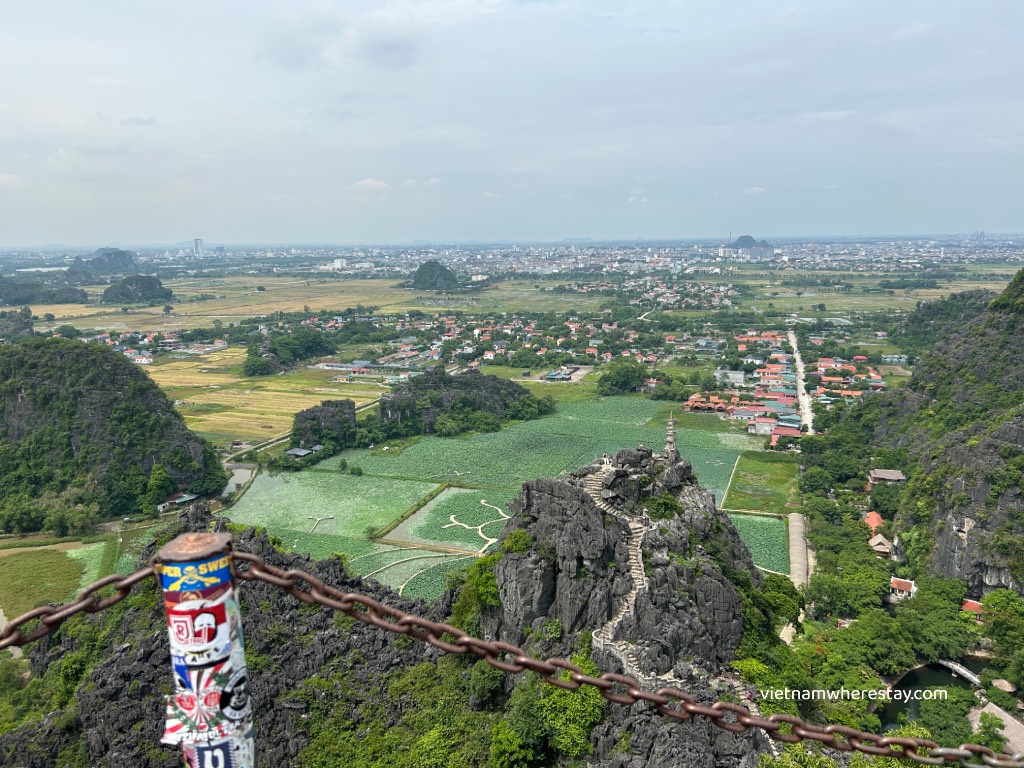 View to Lotus Lake and the Small temple Mountain at the tail of Dragon Statue Mua Cave