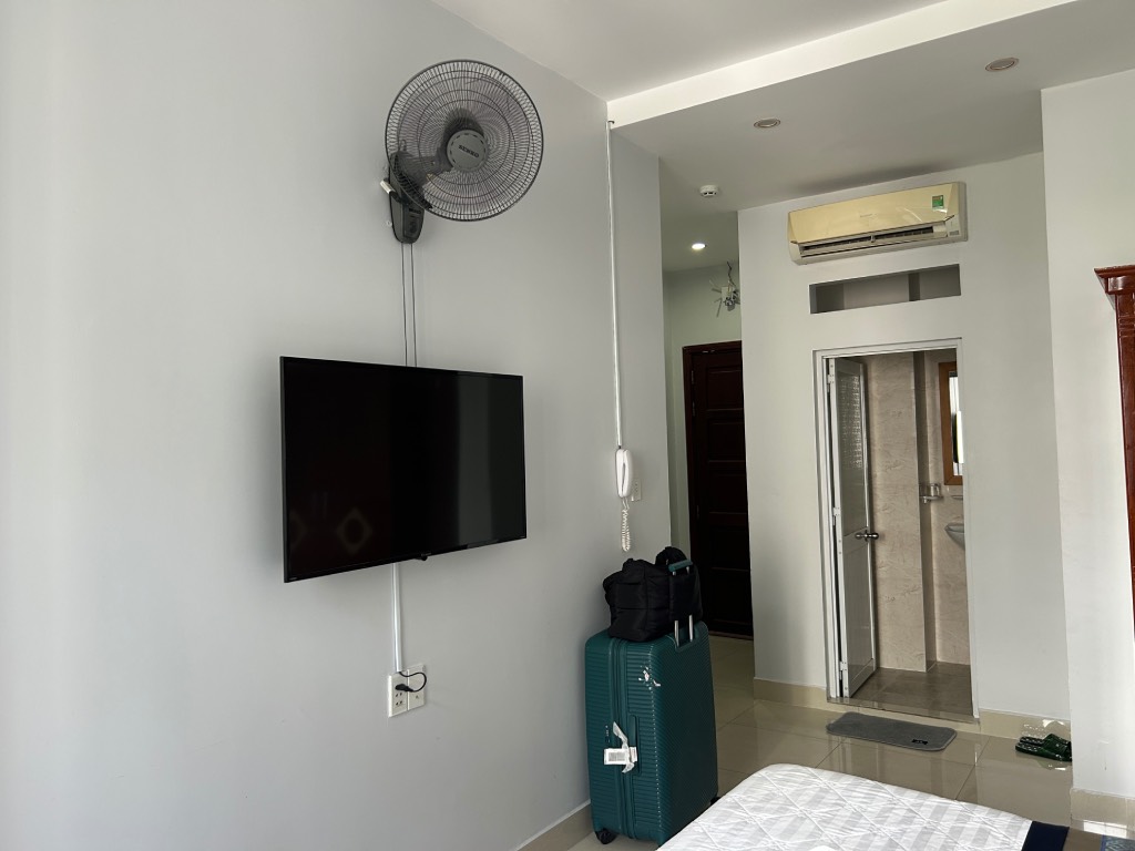 Tv and fan at Green Airport Hotel